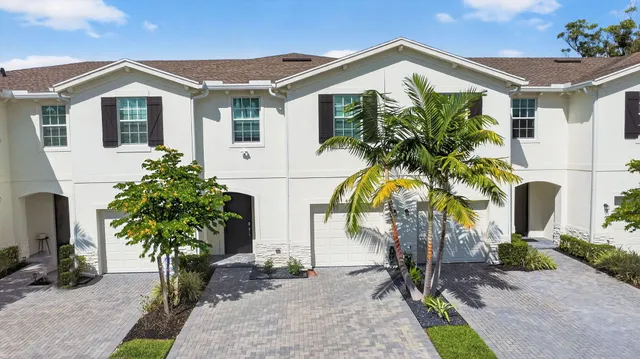 an aerial view of a house with a lake view