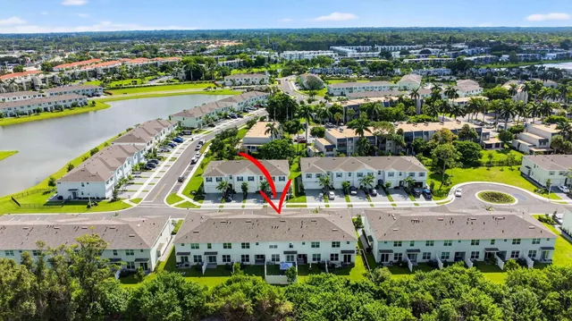 a aerial view of a house with a yard