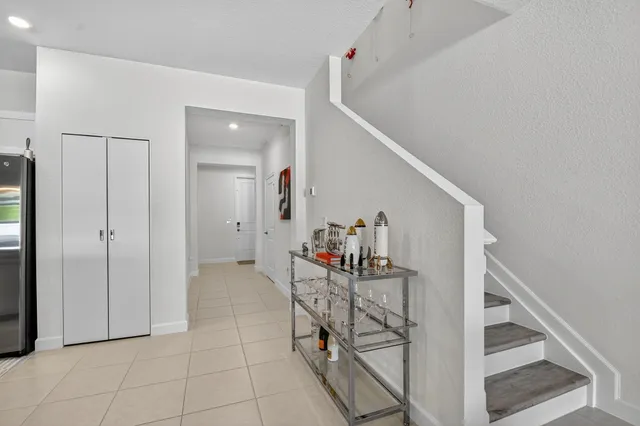 a view of a hallway with workspace and entryway