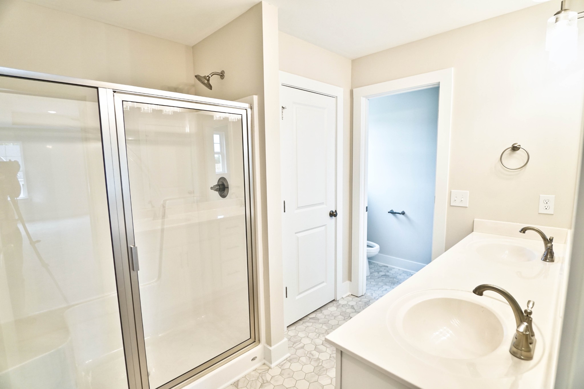 615 Vrabel Road Murfreesboro, TN 37130 - Photo 13 of 17 Primary bath includes double vanities and a large shower.