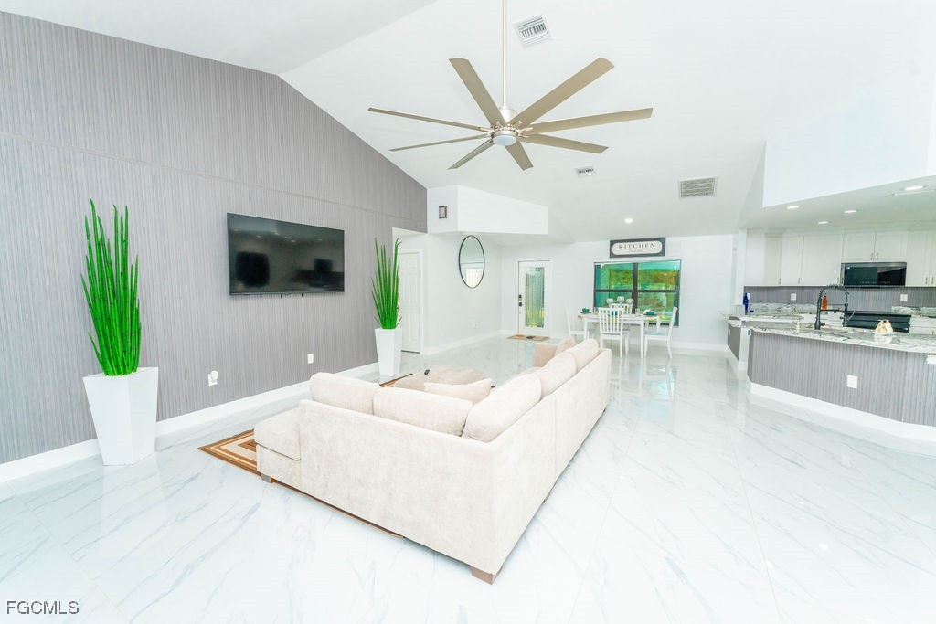 3613 39th Street Southwest Lehigh Acres, FL 33976 - Photo 12 of 46 a living room with furniture and a large window