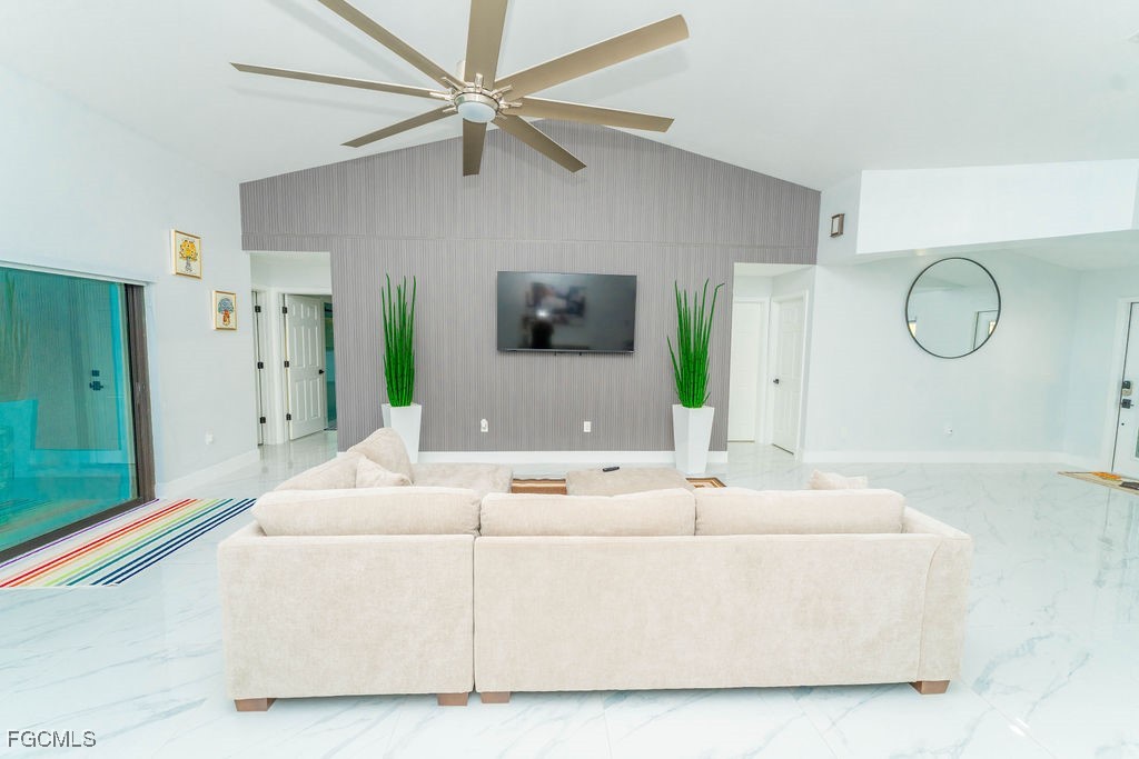3613 39th Street Southwest Lehigh Acres, FL 33976 - Photo 13 of 46 a living room with furniture and a large window