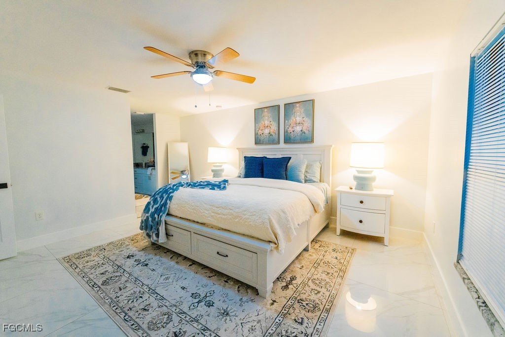 3613 39th Street Southwest Lehigh Acres, FL 33976 - Photo 22 of 46 a bedroom with a large bed and a window