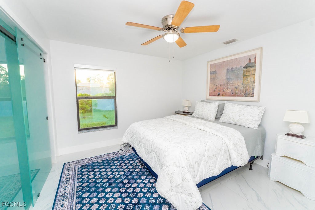 3613 39th Street Southwest Lehigh Acres, FL 33976 - Photo 31 of 46 a bedroom with a bed and a window