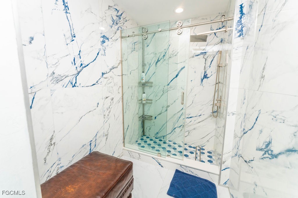 3613 39th Street Southwest Lehigh Acres, FL 33976 - Photo 39 of 46 a bathroom with a shower and a sink