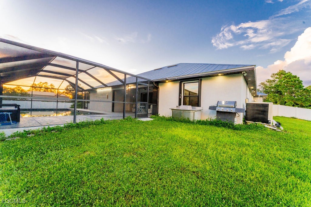 3613 39th Street Southwest Lehigh Acres, FL 33976 - Photo 41 of 46 a view of a house with backyard and patio
