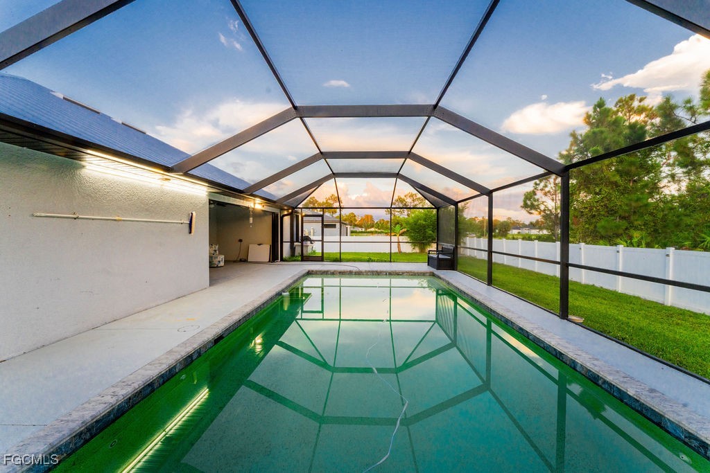 3613 39th Street Southwest Lehigh Acres, FL 33976 - Photo 7 of 46 a swimming pool with a yard