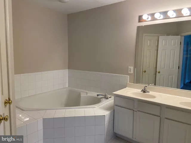 a bathroom with a sink and mirror