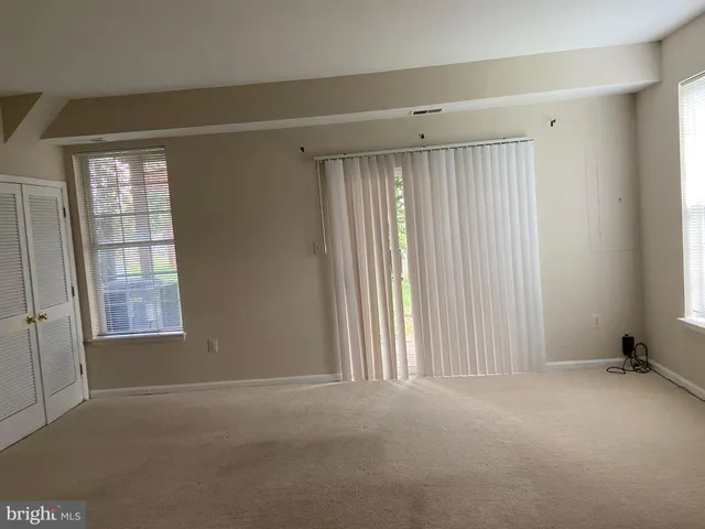 a view of an empty room with empty shelves