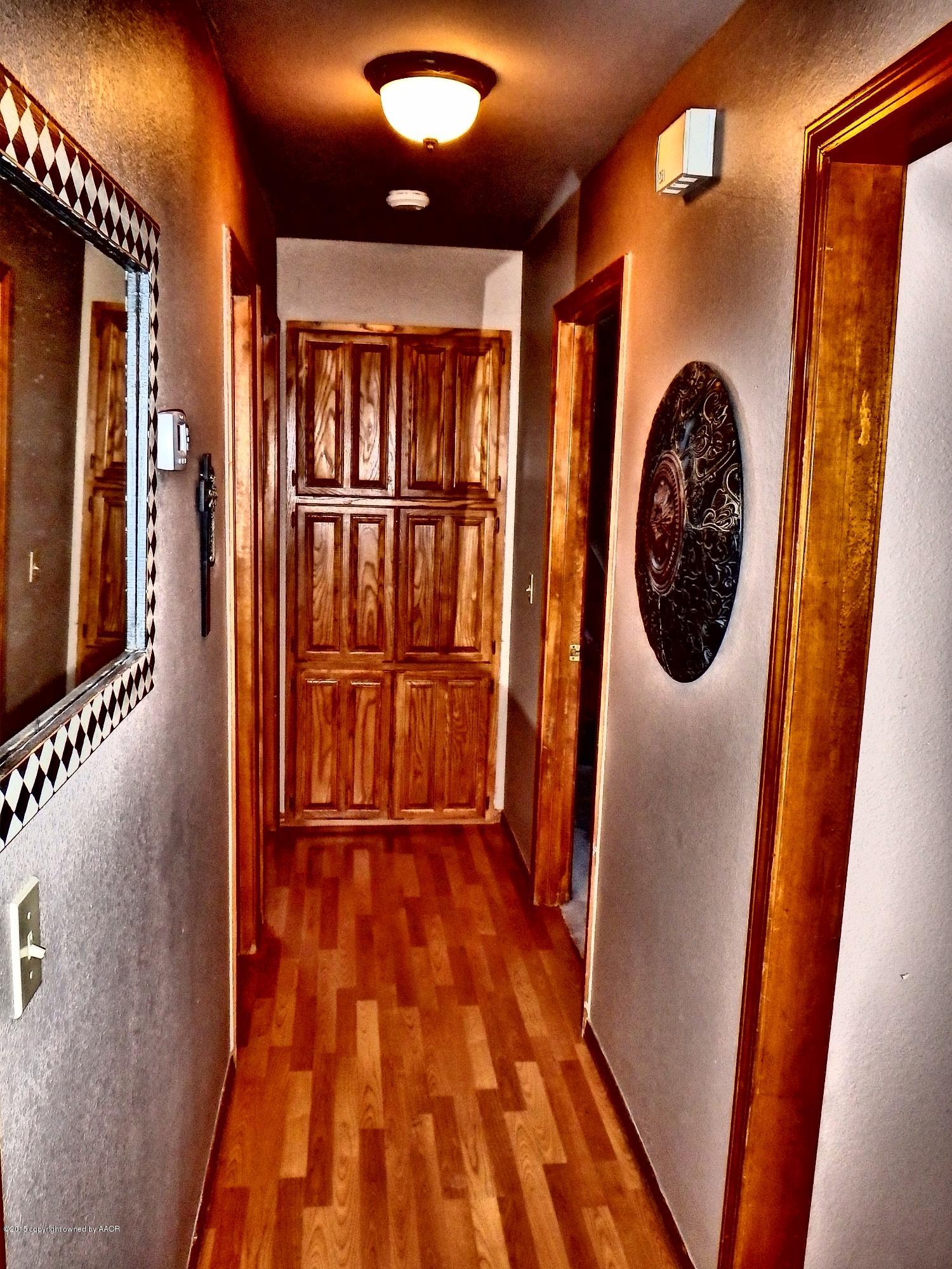 4203 Rincon Avenue Amarillo, TX 79110 - Photo 13 of 39 a view of entryway door with wooden floor