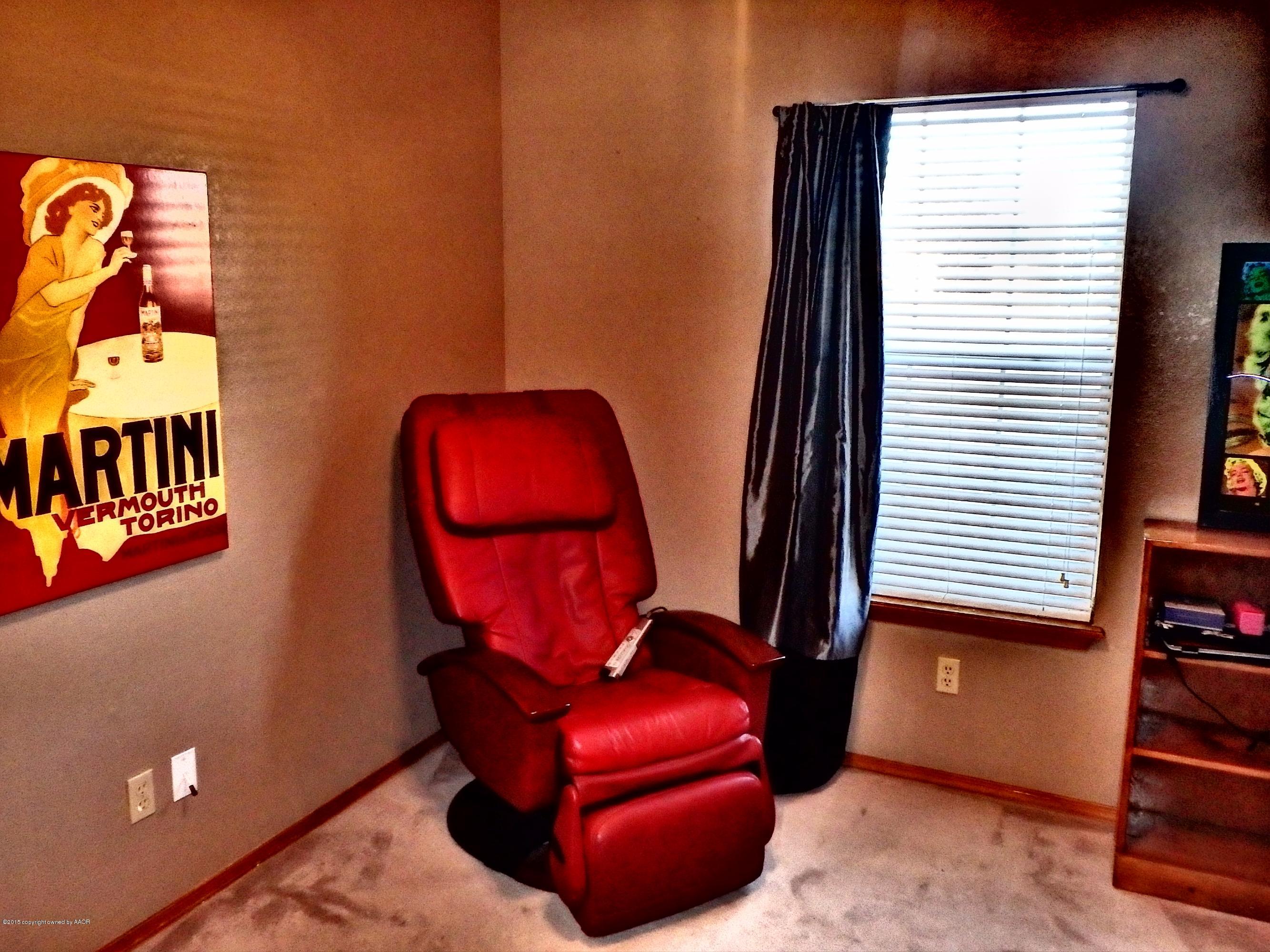 4203 Rincon Avenue Amarillo, TX 79110 - Photo 19 of 39 a room with furniture and a window