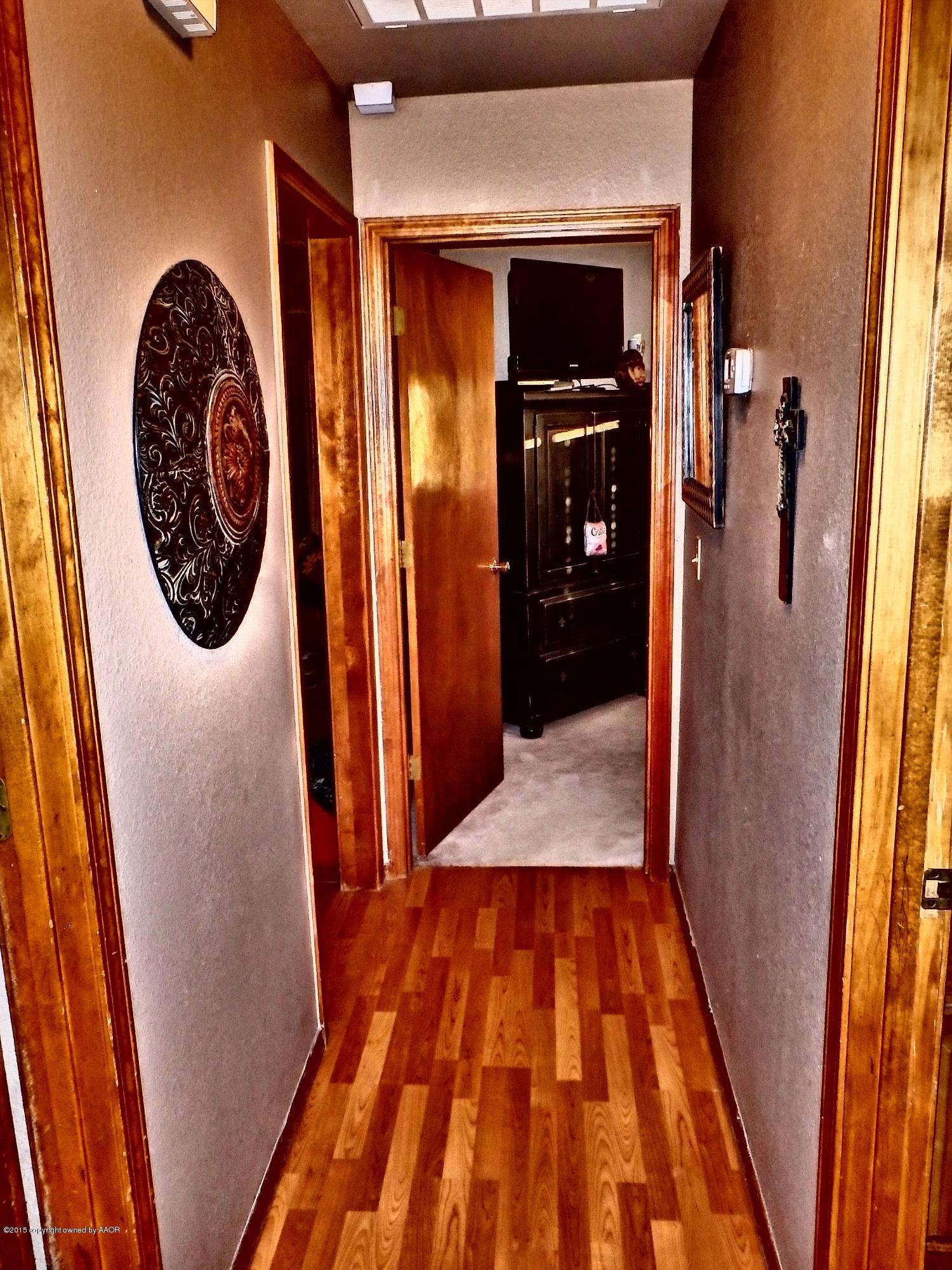 4203 Rincon Avenue Amarillo, TX 79110 - Photo 20 of 39 a hallway with wooden floor