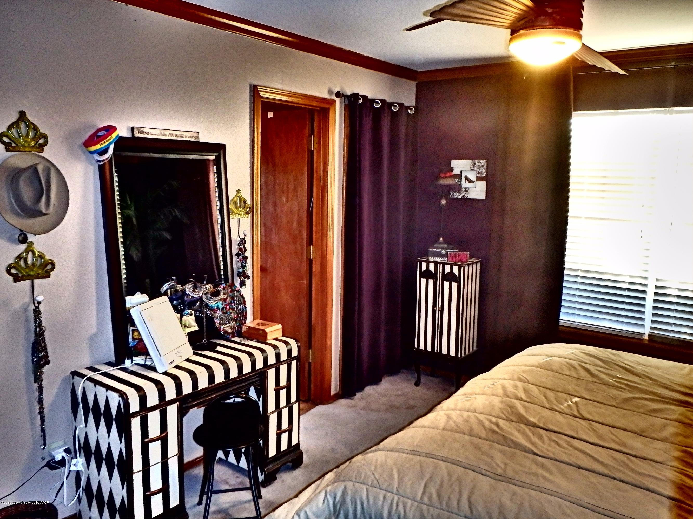 4203 Rincon Avenue Amarillo, TX 79110 - Photo 23 of 39 a bedroom with a bed and a closet