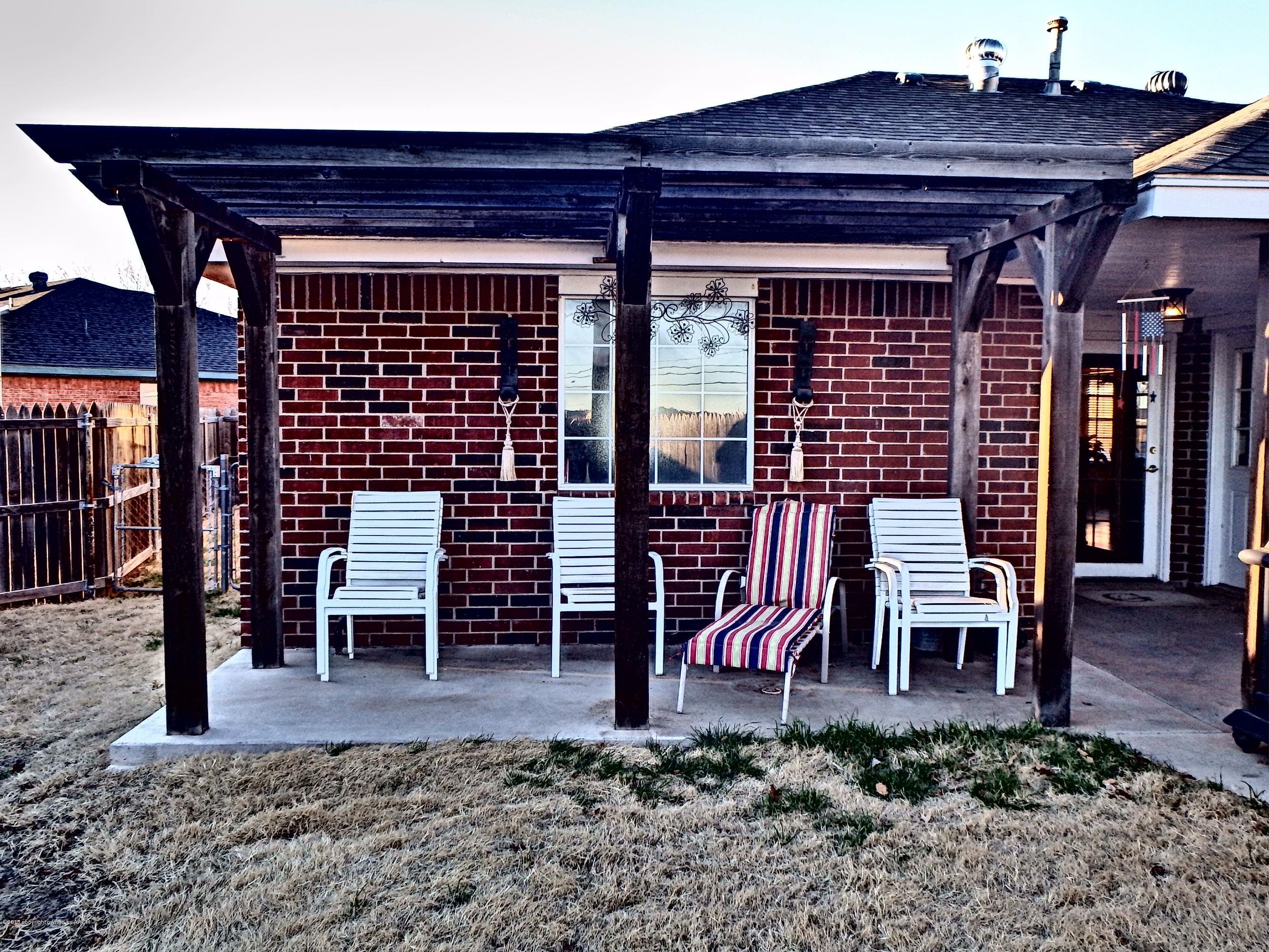 4203 Rincon Avenue Amarillo, TX 79110 - Photo 34 of 39 a view of a chairs and table in the patio
