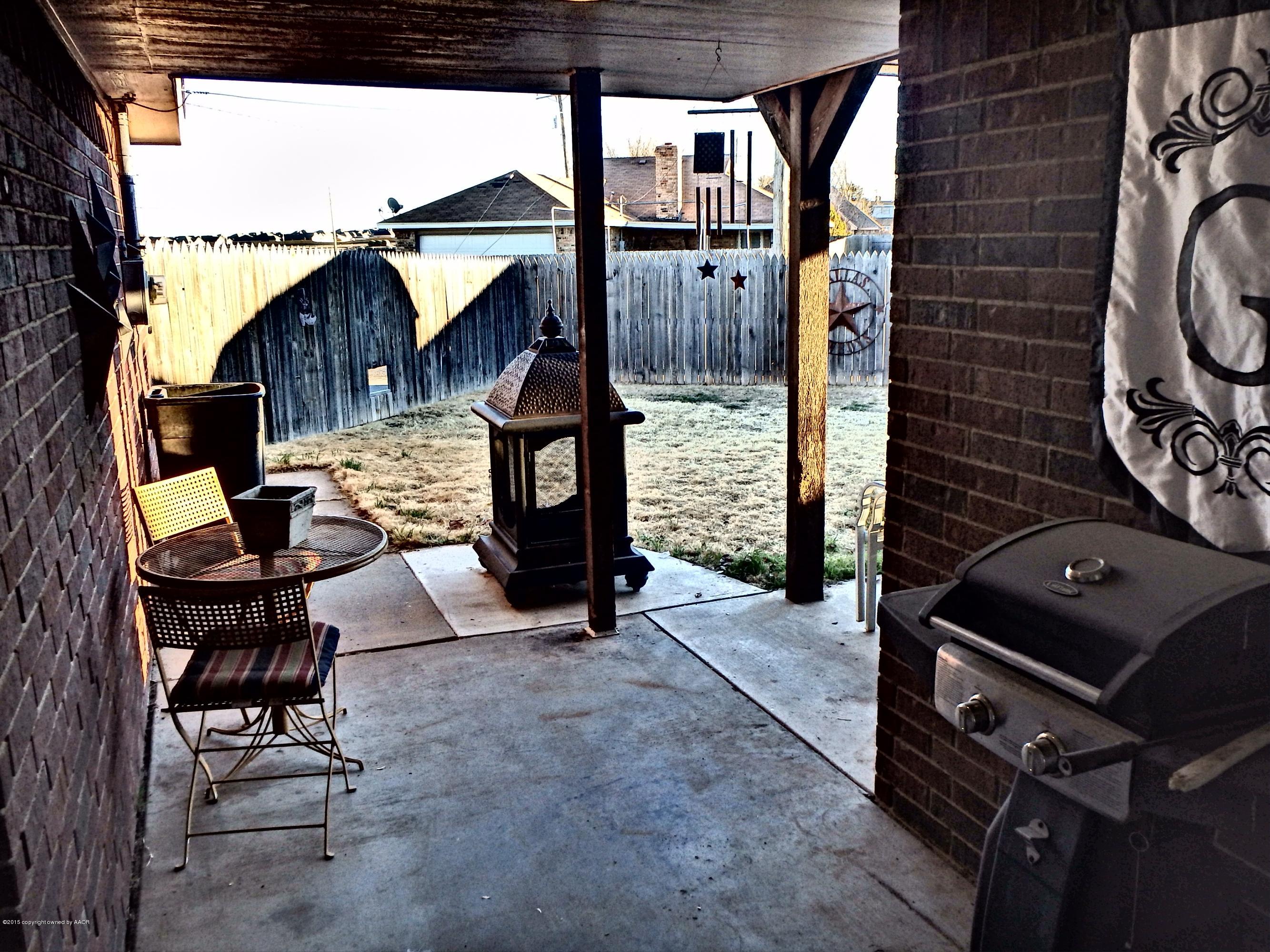 4203 Rincon Avenue Amarillo, TX 79110 - Photo 35 of 39 a backyard of a house with seating space