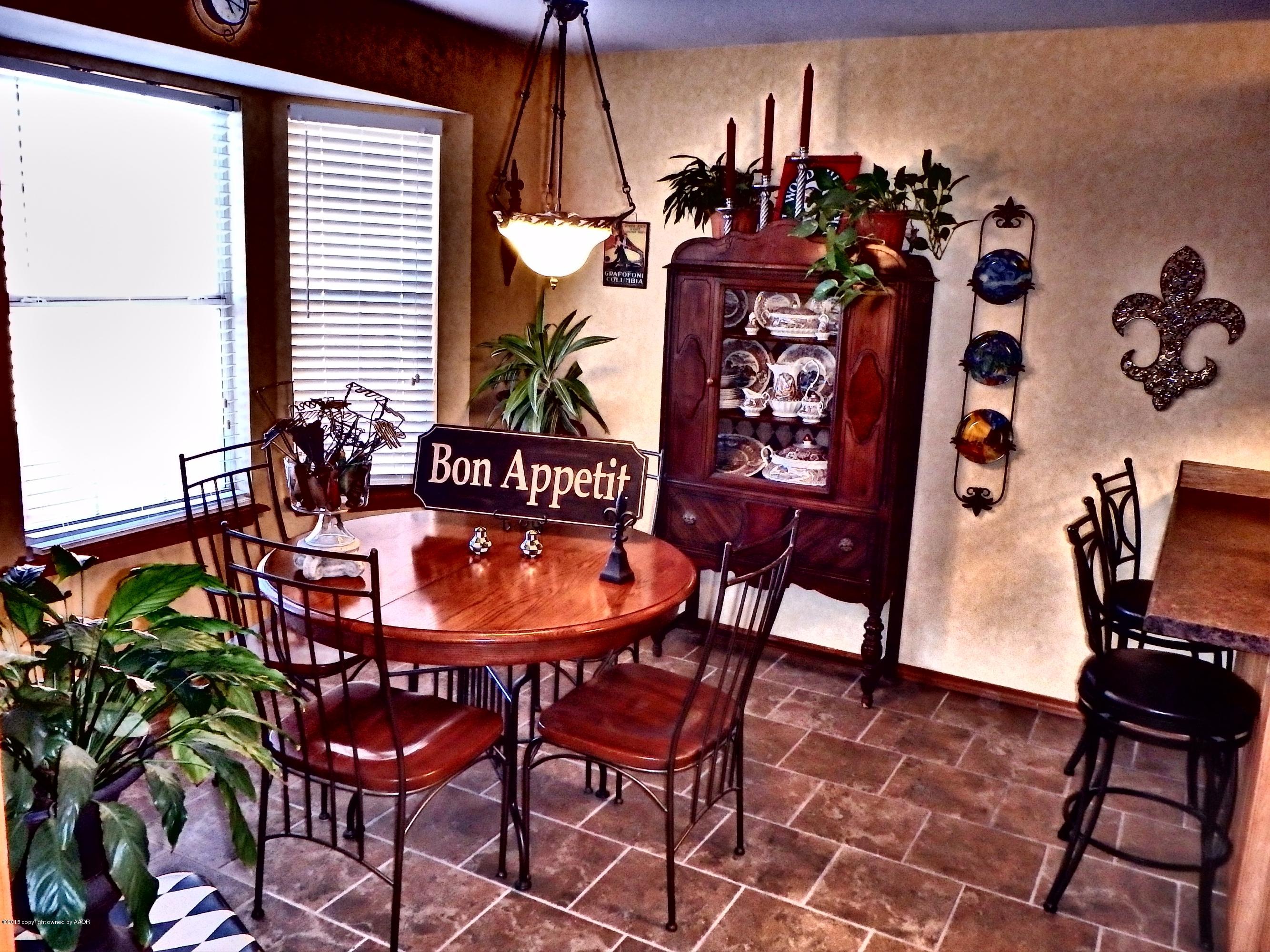 4203 Rincon Avenue Amarillo, TX 79110 - Photo 8 of 39 a view of a chairs and table in a patio
