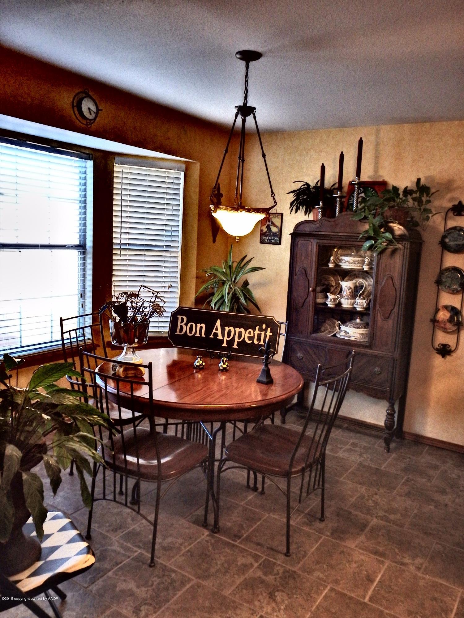 4203 Rincon Avenue Amarillo, TX 79110 - Photo 9 of 39 a view of a dining room with furniture and window