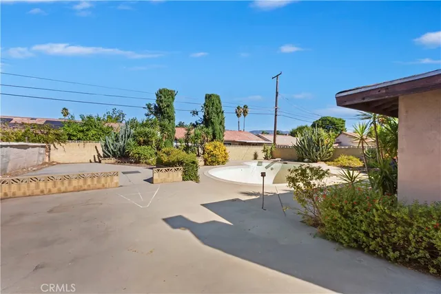 a view of a swimming pool with a patio