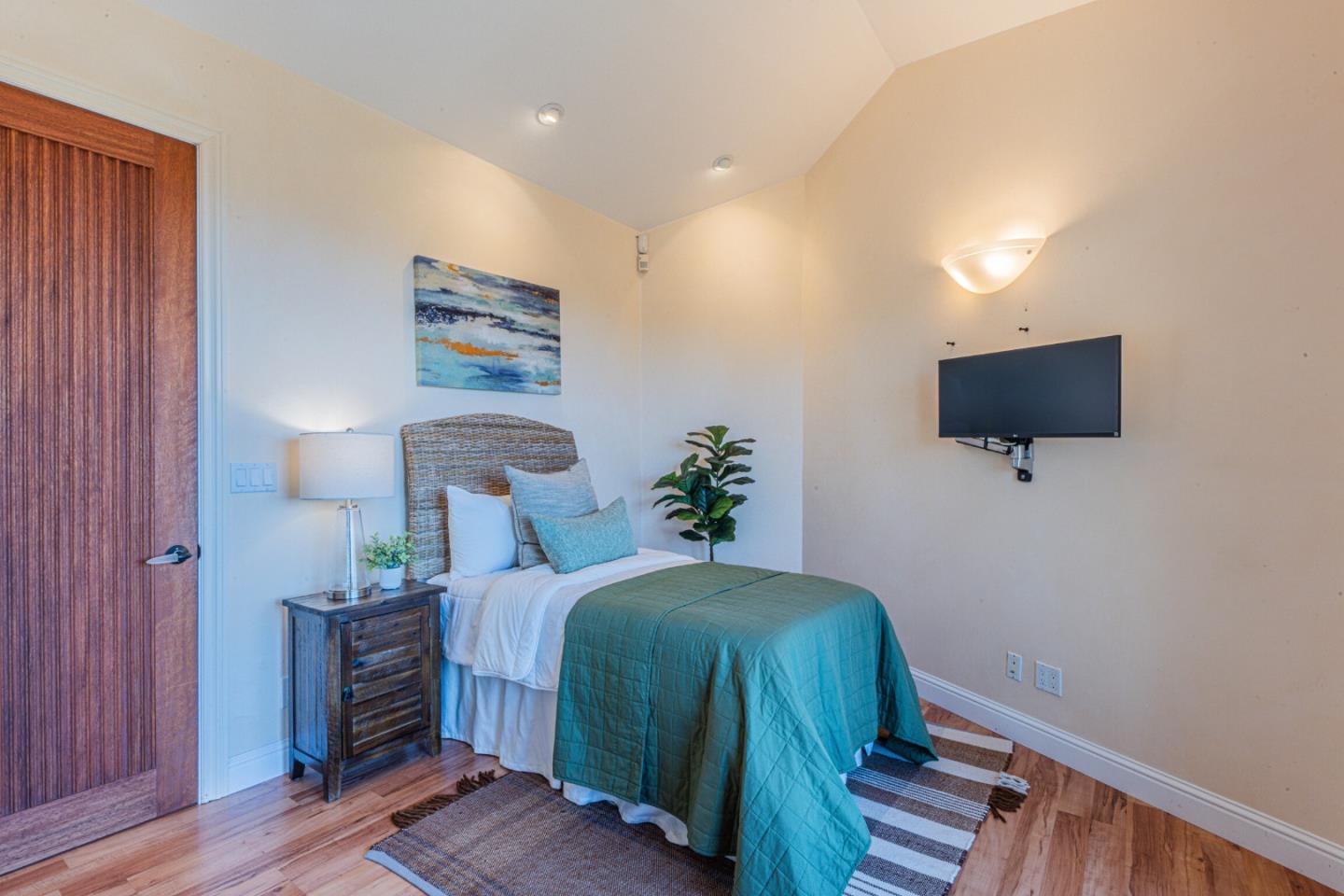 430 Quail Run Road Aptos, CA 95003 - Photo 28 of 34 a bedroom with a bed and a television