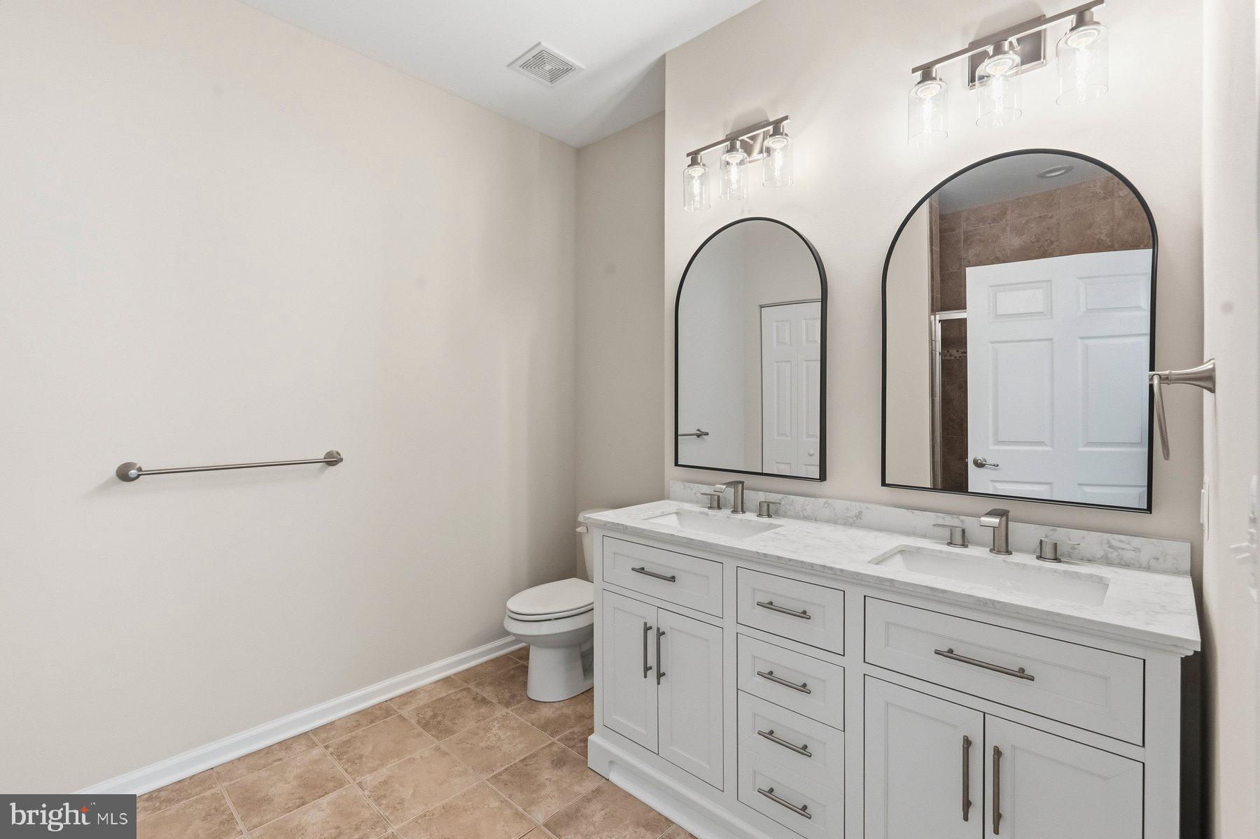 637 Wallingford Road, Unit 401 Bel Air, MD 21014 - Photo 18 of 28 Elegant dual-sink bathroom retreat.