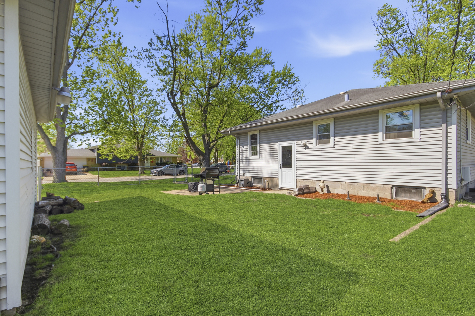 18655 Sherman Street Lansing, IL 60438 - Photo 20 of 21 a front view of house with yard and green space