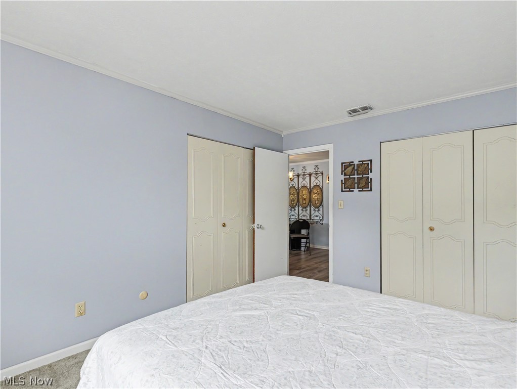 3064 Kent Road Stow, OH 44224 - Photo 14 of 30 White bi-fold closet doors, light blue painted walls, and light-colored carpeting