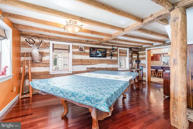 a kitchen with stainless steel appliances granite countertop a sink and a refrigerator