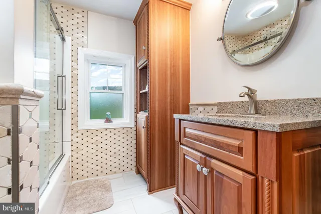 a bedroom with a bed and a flat tv screen