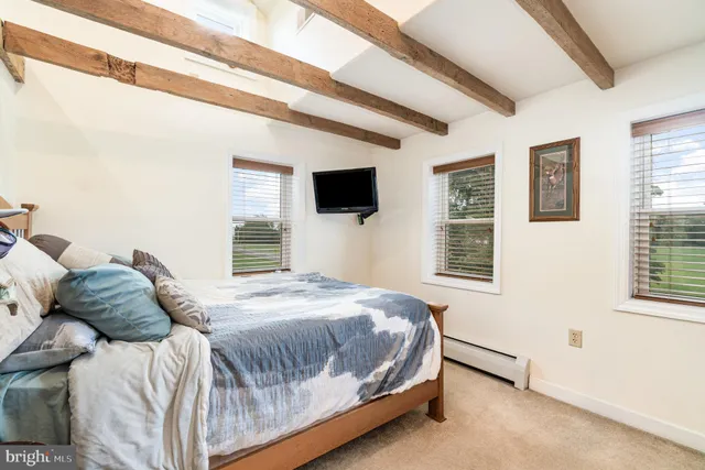 a bedroom with a bed and walk in closet