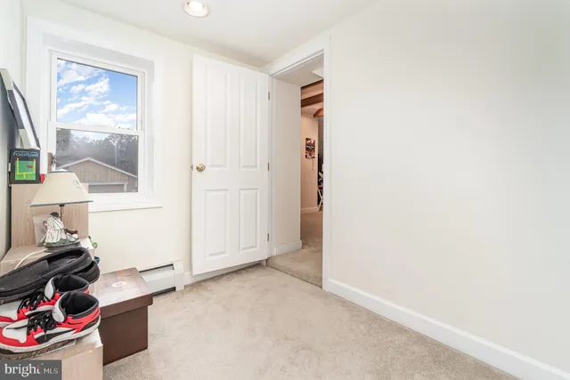 a room with stainless steel appliances lots of table and chairs