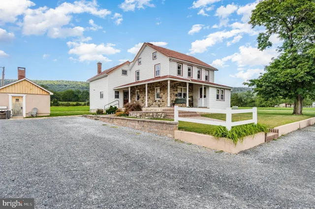 a view of house with outdoor space and porch