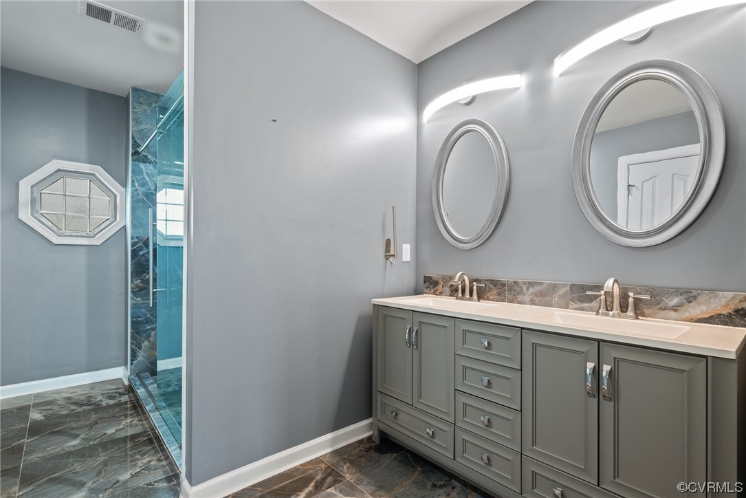 15 Brough Lane Hampton, VA 23669 - Photo 13 of 43 a bathroom with a double vanity sink and a mirror