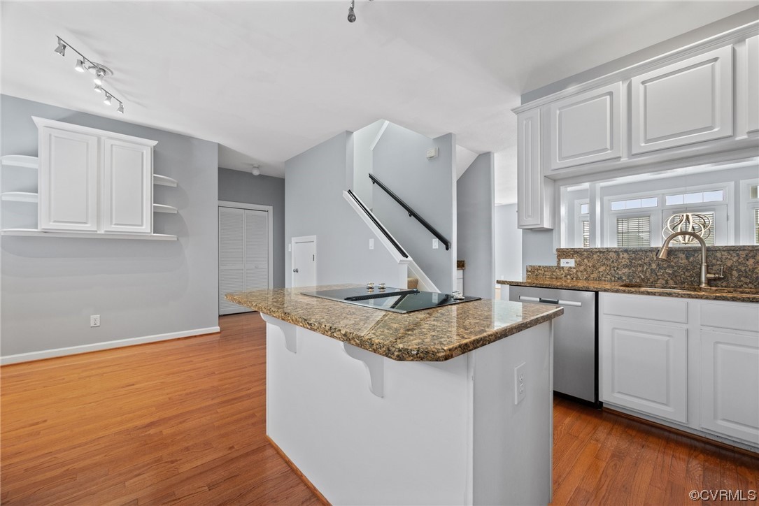 15 Brough Lane Hampton, VA 23669 - Photo 33 of 43 a kitchen with kitchen island granite countertop a sink a stove and cabinets