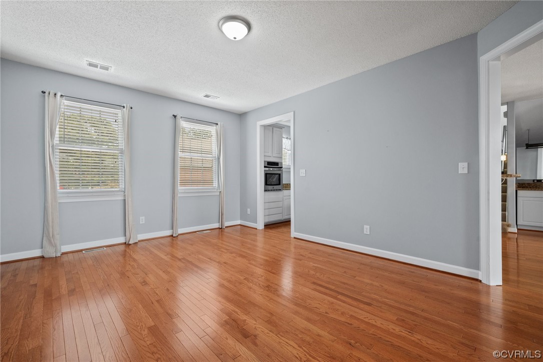 15 Brough Lane Hampton, VA 23669 - Photo 35 of 43 an empty room with wooden floor and windows