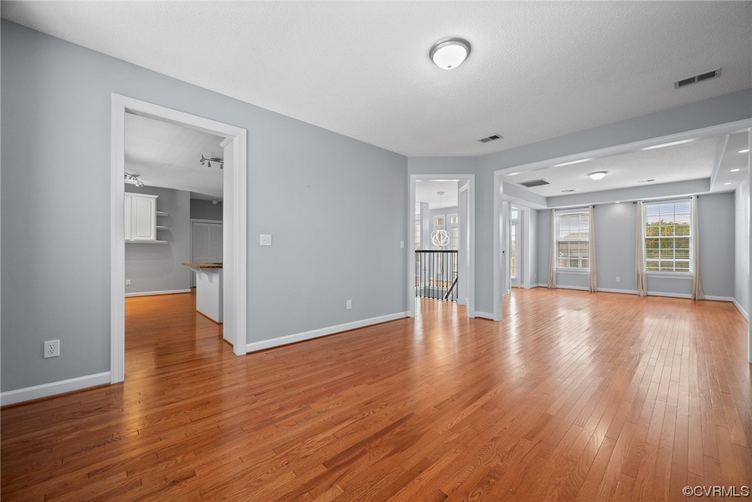 15 Brough Lane Hampton, VA 23669 - Photo 9 of 43 a view of an empty room with wooden floor and a window