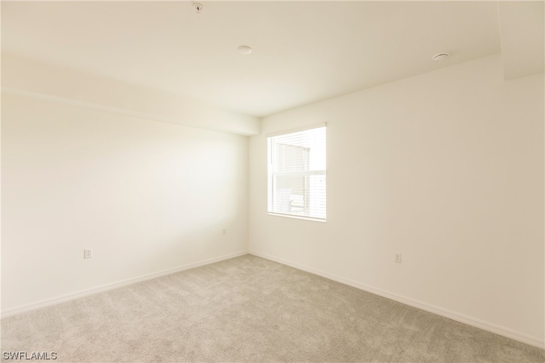 43997 Boardwalk Loop, Unit 1818 Punta Gorda, FL 33982 - Photo 11 of 40 an empty room with a window