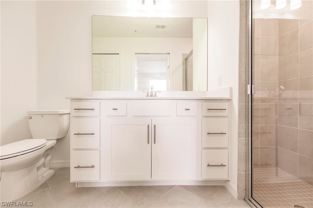 43997 Boardwalk Loop, Unit 1818 Punta Gorda, FL 33982 - Photo 16 of 40 a bathroom with a sink a toilet and shower