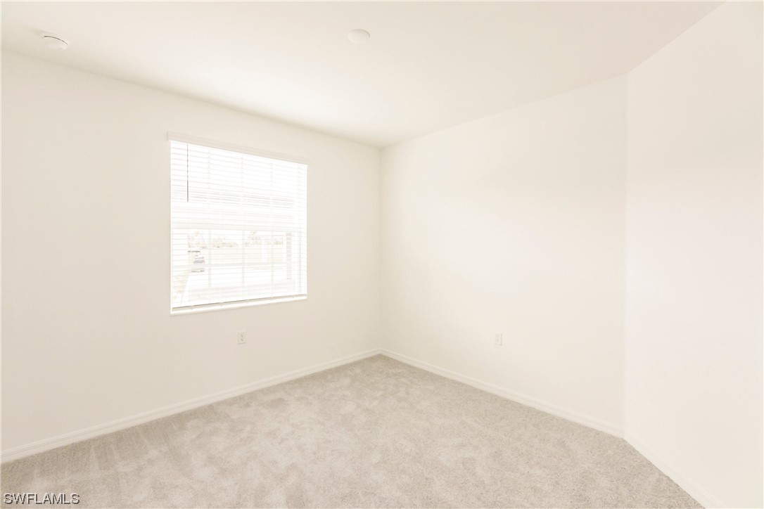 43997 Boardwalk Loop, Unit 1818 Punta Gorda, FL 33982 - Photo 18 of 40 an empty room with a window