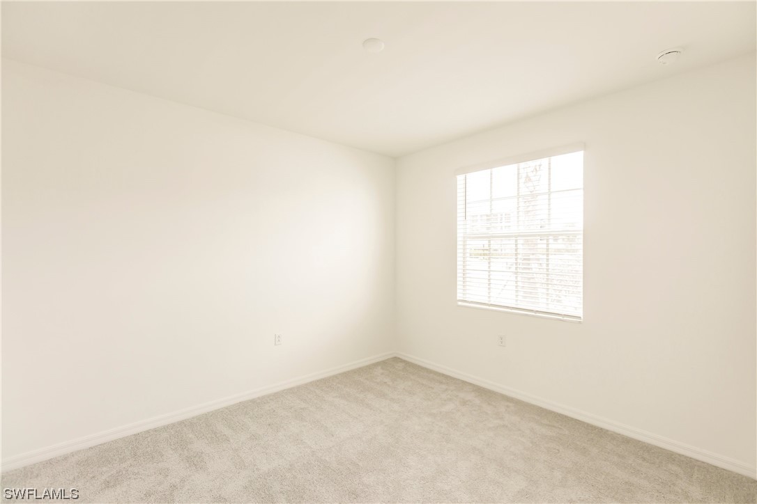 43997 Boardwalk Loop, Unit 1818 Punta Gorda, FL 33982 - Photo 20 of 40 an empty room with a window