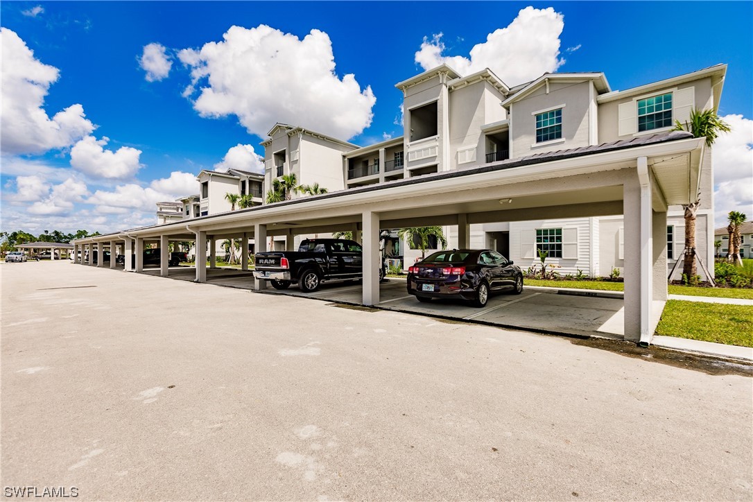 43997 Boardwalk Loop, Unit 1818 Punta Gorda, FL 33982 - Photo 2 of 40 a couple of cars parked in front of a building