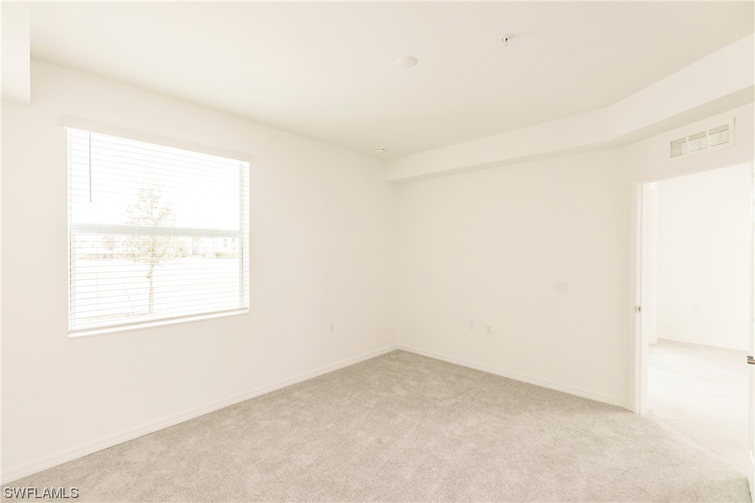 43997 Boardwalk Loop, Unit 1818 Punta Gorda, FL 33982 - Photo 23 of 40 an empty room with a window