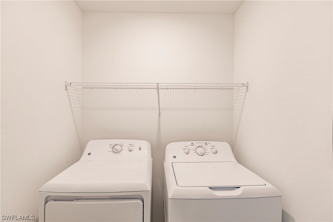 43997 Boardwalk Loop, Unit 1818 Punta Gorda, FL 33982 - Photo 28 of 40 a utility room with dryer and washer