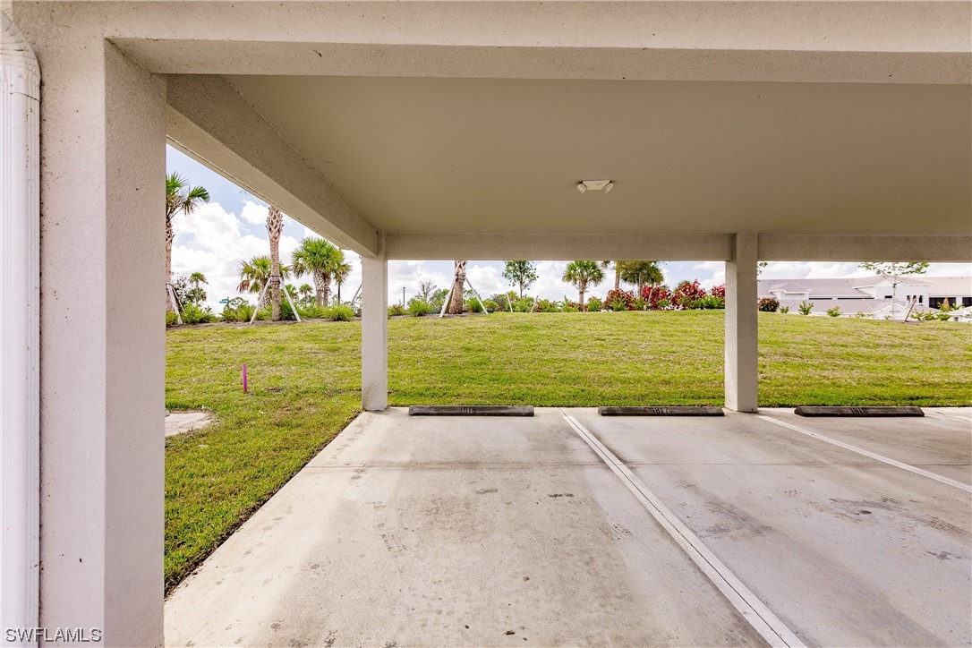 43997 Boardwalk Loop, Unit 1818 Punta Gorda, FL 33982 - Photo 38 of 40 a view of a big yard with an outdoor seating