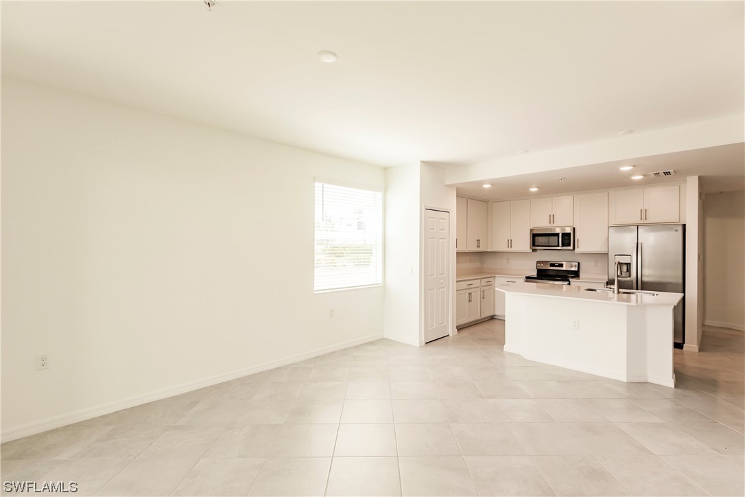 43997 Boardwalk Loop, Unit 1818 Punta Gorda, FL 33982 - Photo 4 of 40 a view of a kitchen with refrigerator sink and stove