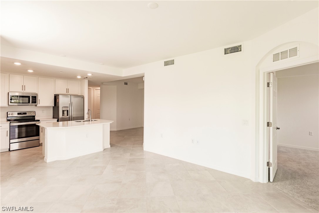 43997 Boardwalk Loop, Unit 1818 Punta Gorda, FL 33982 - Photo 6 of 40 a view of kitchen with stainless steel appliances cabinets