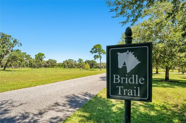 a sign that is on a pole on a wall