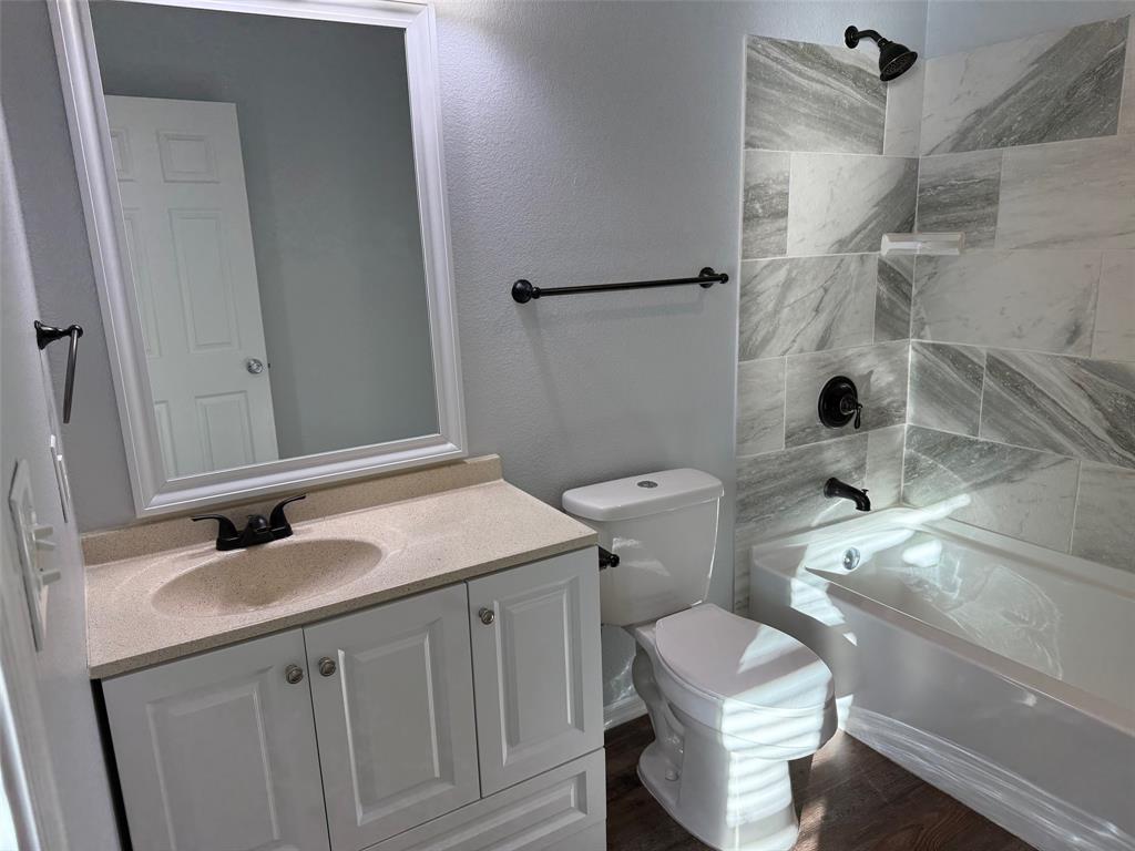 1826 North Woods Street Sherman, TX 75092 - Photo 11 of 29 a bathroom with a sink toilet and shower