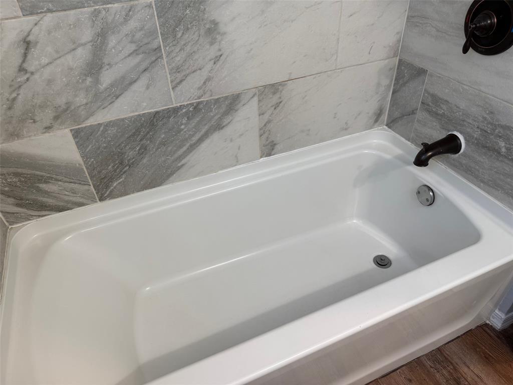 1826 North Woods Street Sherman, TX 75092 - Photo 13 of 29 a bathroom with a tub