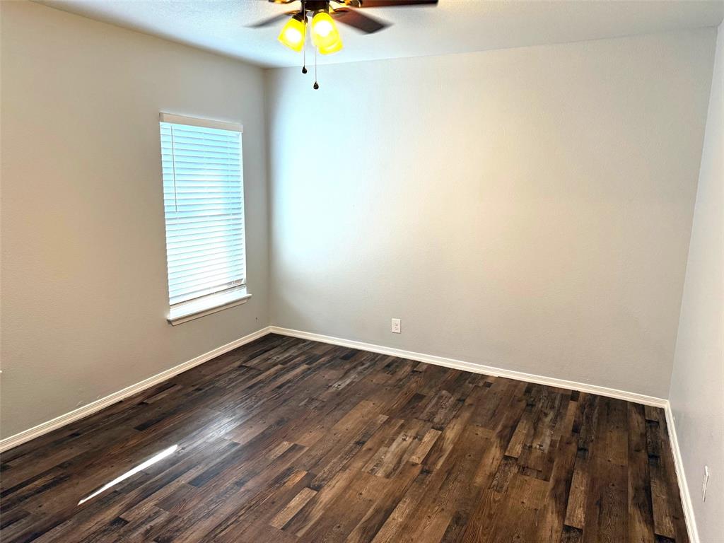 1826 North Woods Street Sherman, TX 75092 - Photo 18 of 29 an empty room with a window