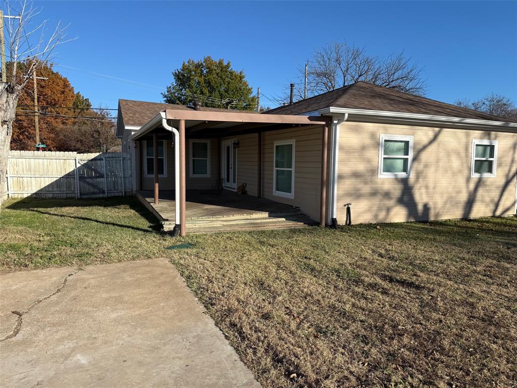 1826 North Woods Street Sherman, TX 75092 - Photo 24 of 29 a view of a house with a yard